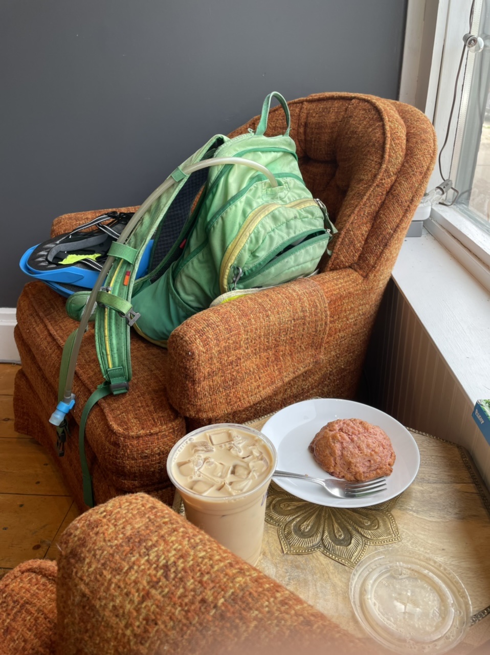 An iced latte, strawberry rhubarb scone, and comfy chairs at this morning’s coffee stop