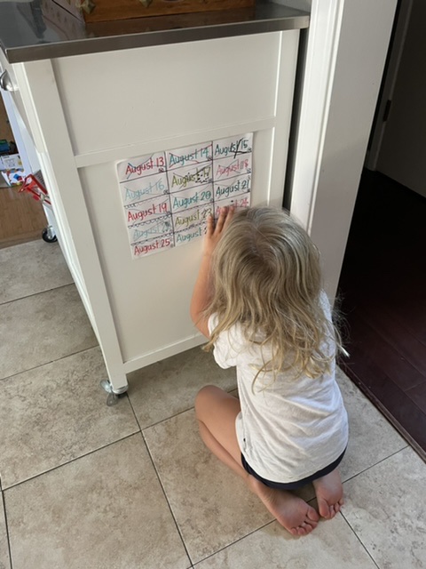 I made it! Claire crossing out the last day on their countdown calendar til my arrival