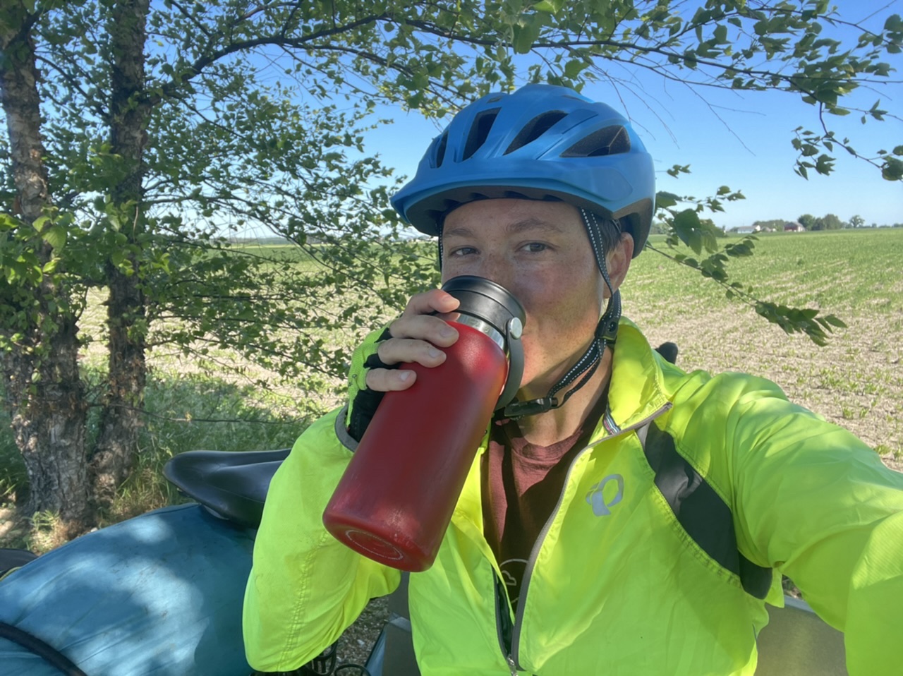 Coffee break on a bike path surrounded by farmland