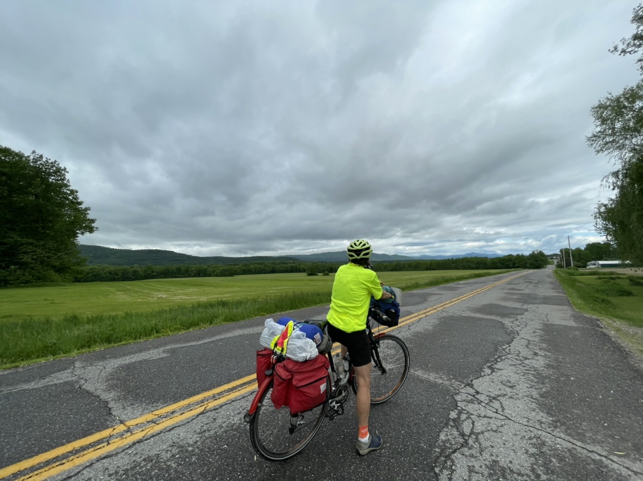 Country lanes surrounded by farmland with the Adirondacks in the distance