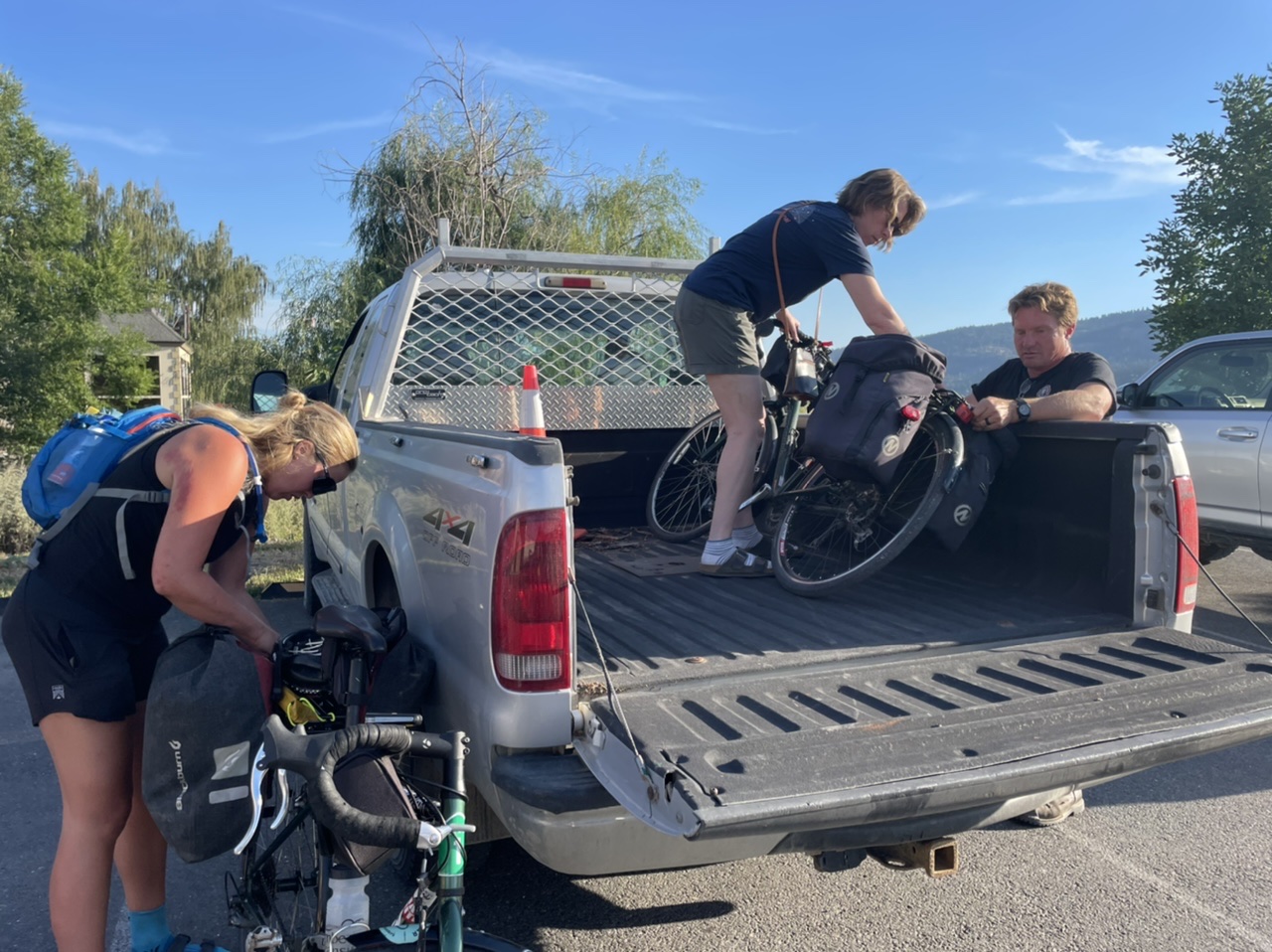 Amy and Jason loading up our bikes to head to their place up a big hill via a dirt road