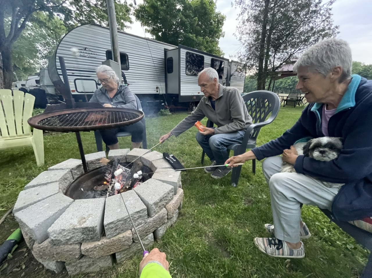 Toasting marshmallows with my campsite neighbors: Joanne, Gord, Deb, and Lucy (the dog)