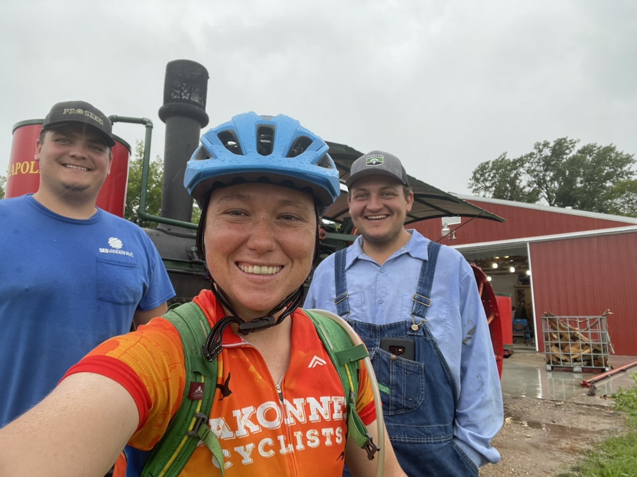 Cole, me, and Craig in front of their steam engine tractor